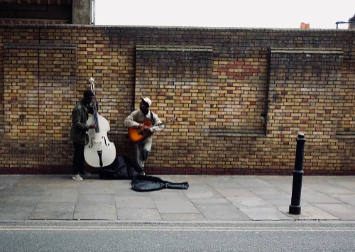buskers by wall performing