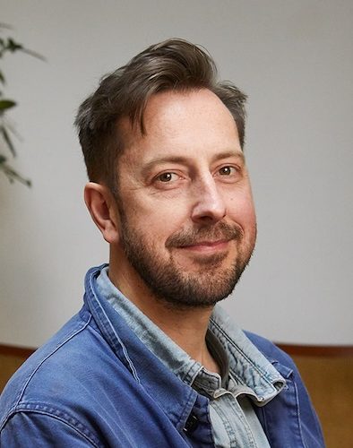 singing teacher looking at camera for a headshot