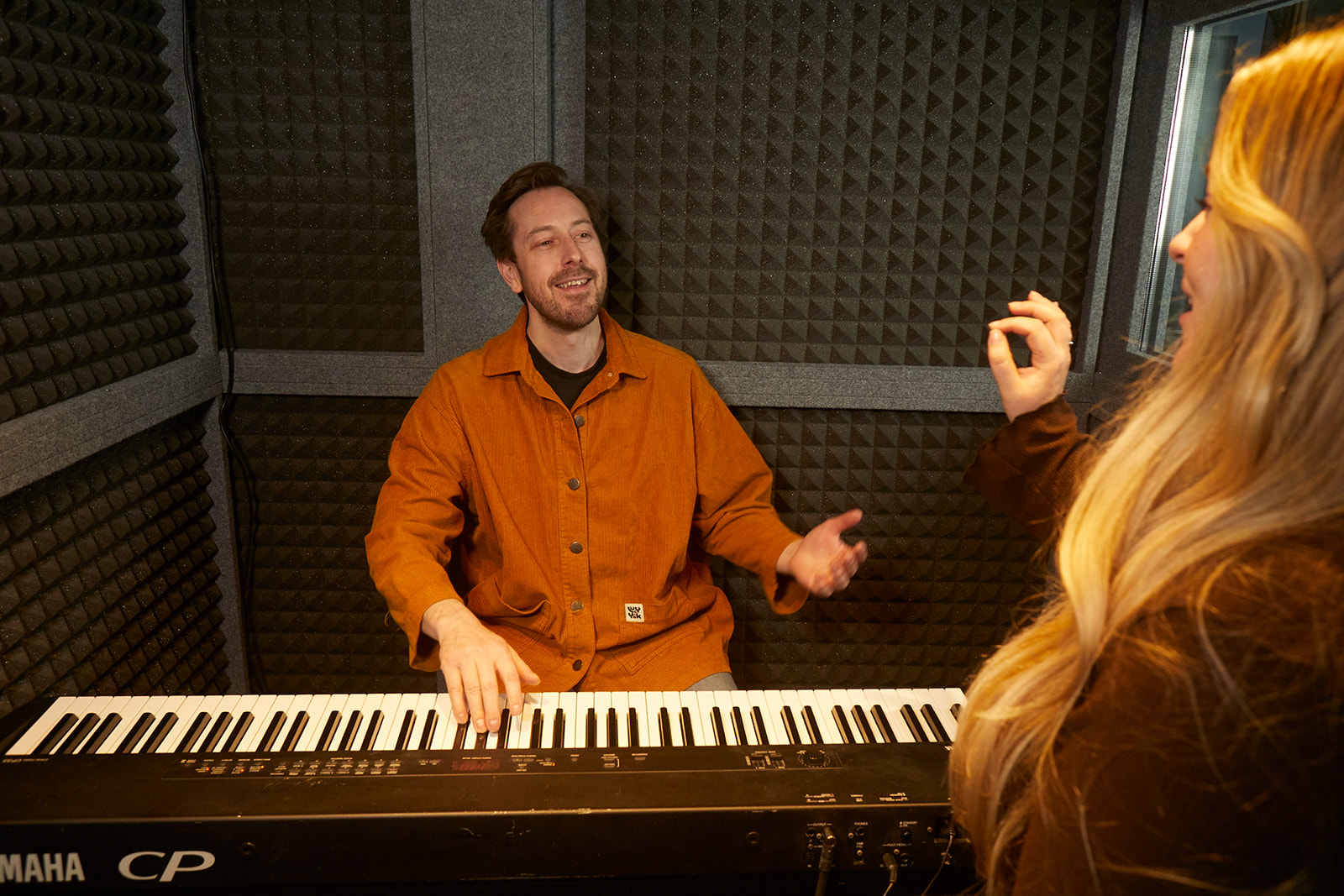 Sam teaching a singer beginners